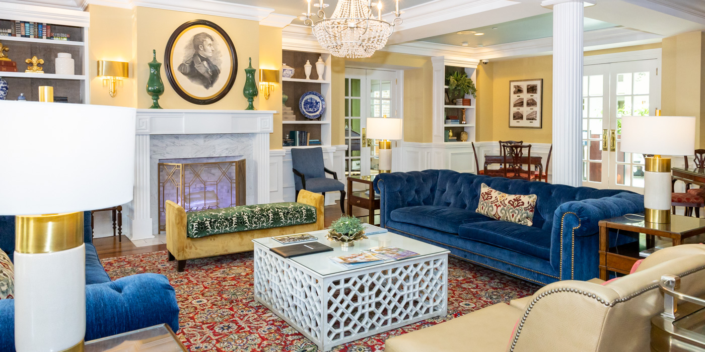 a living room with a fireplace and couches