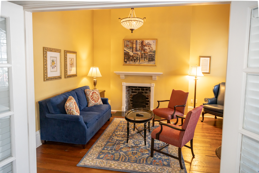 a living room with a fireplace and couches
