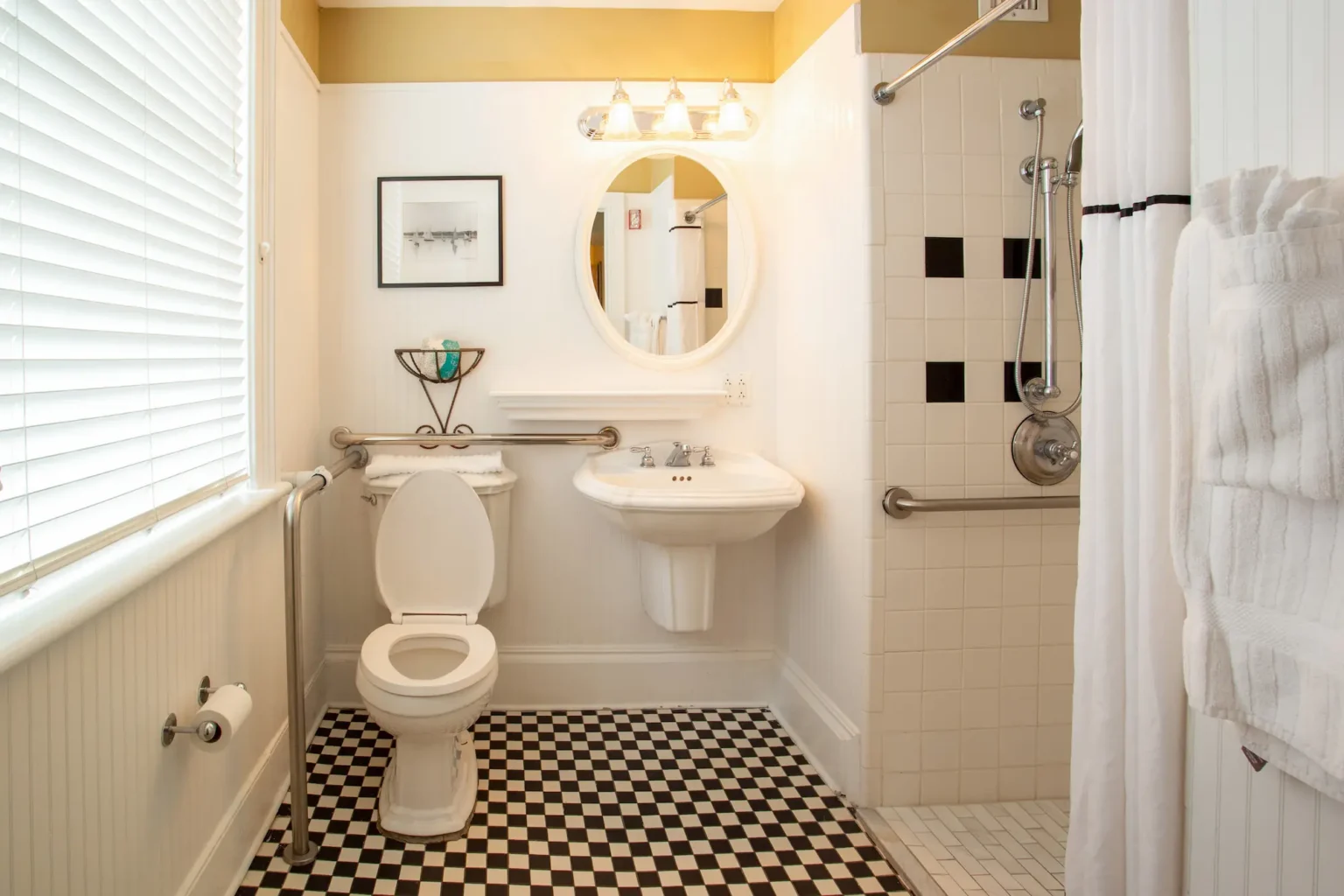 the spacious bathroom of an accessible king room at the Marshall House hotel