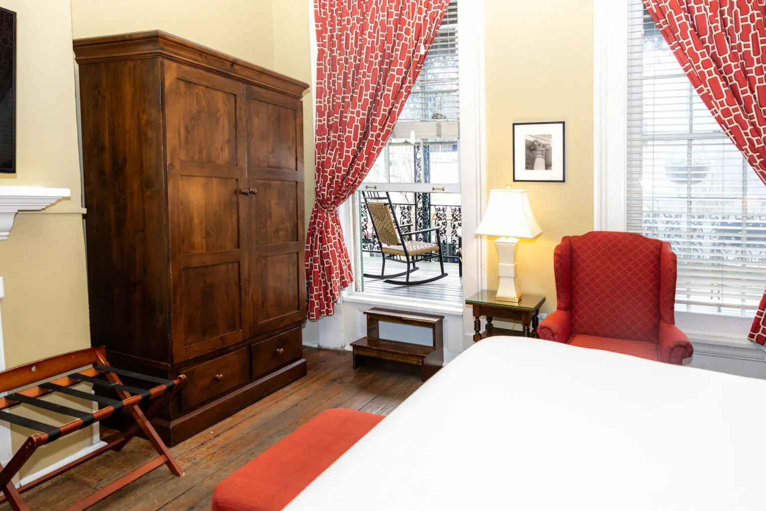 a Balcony King room at the Marshall House hotel, with a small step up out the window to the veranda