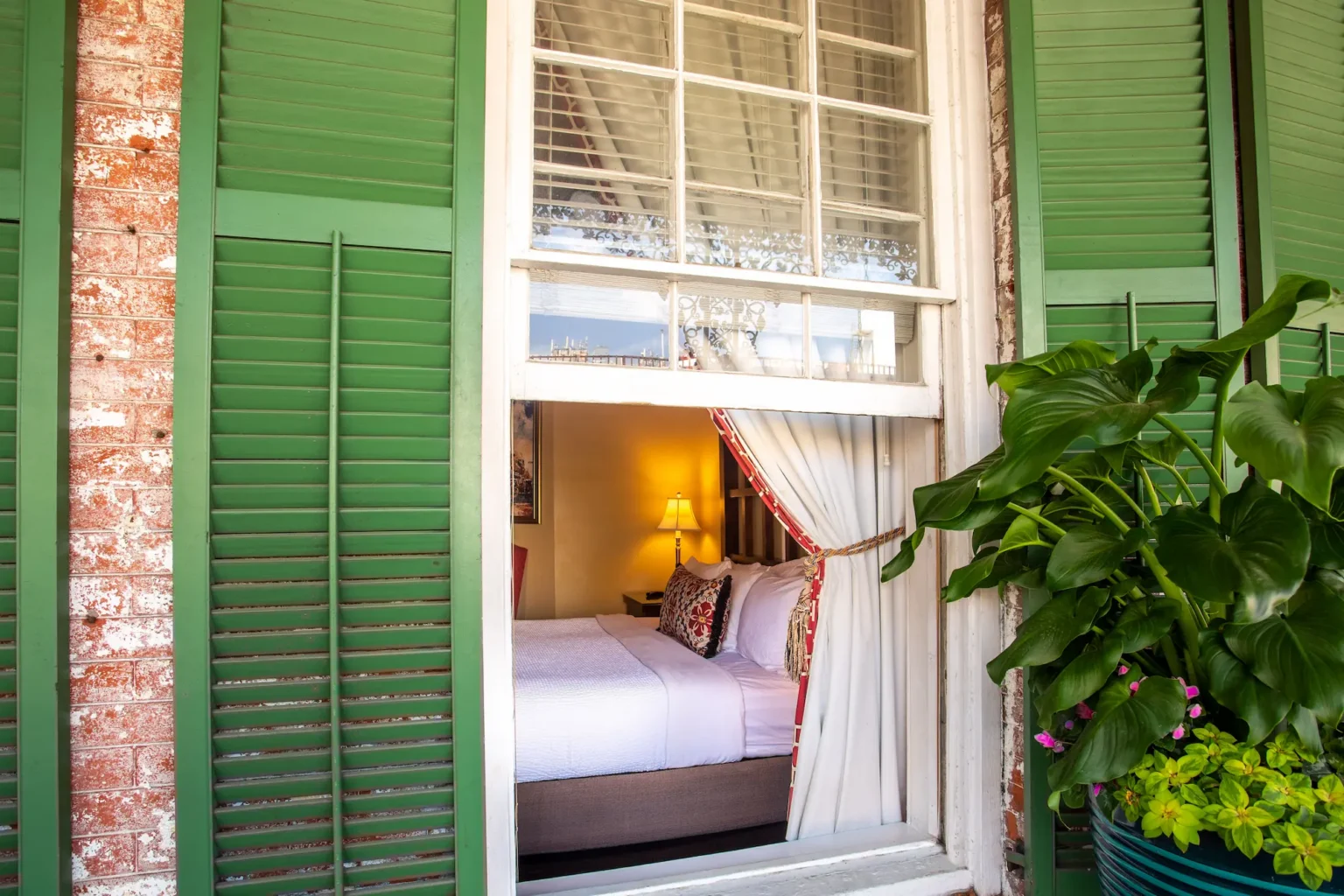 a view from the veranda back into a Balcony King room at the Marshall House hotel