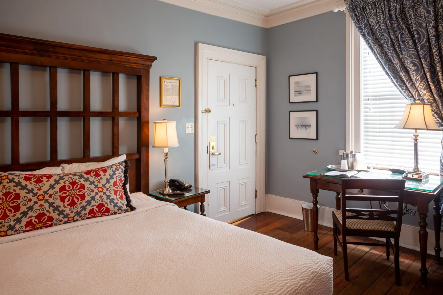 desk and bed in the classic queen room at the Marshall House hotel