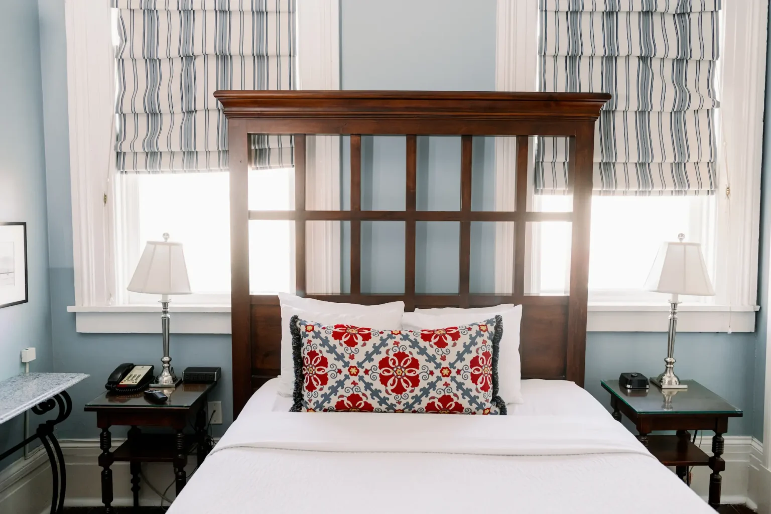 a high headboard on the bed of the classic queen room at the Marshall House hotel