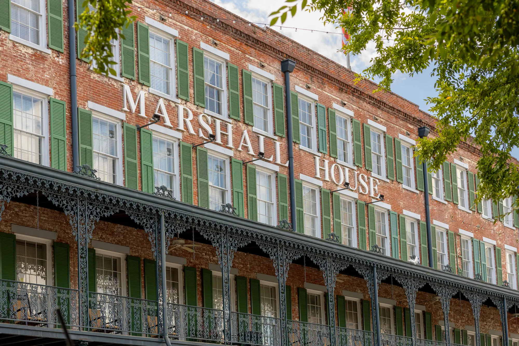 the exterior of the Marshall House in Savannah Georgia in summer