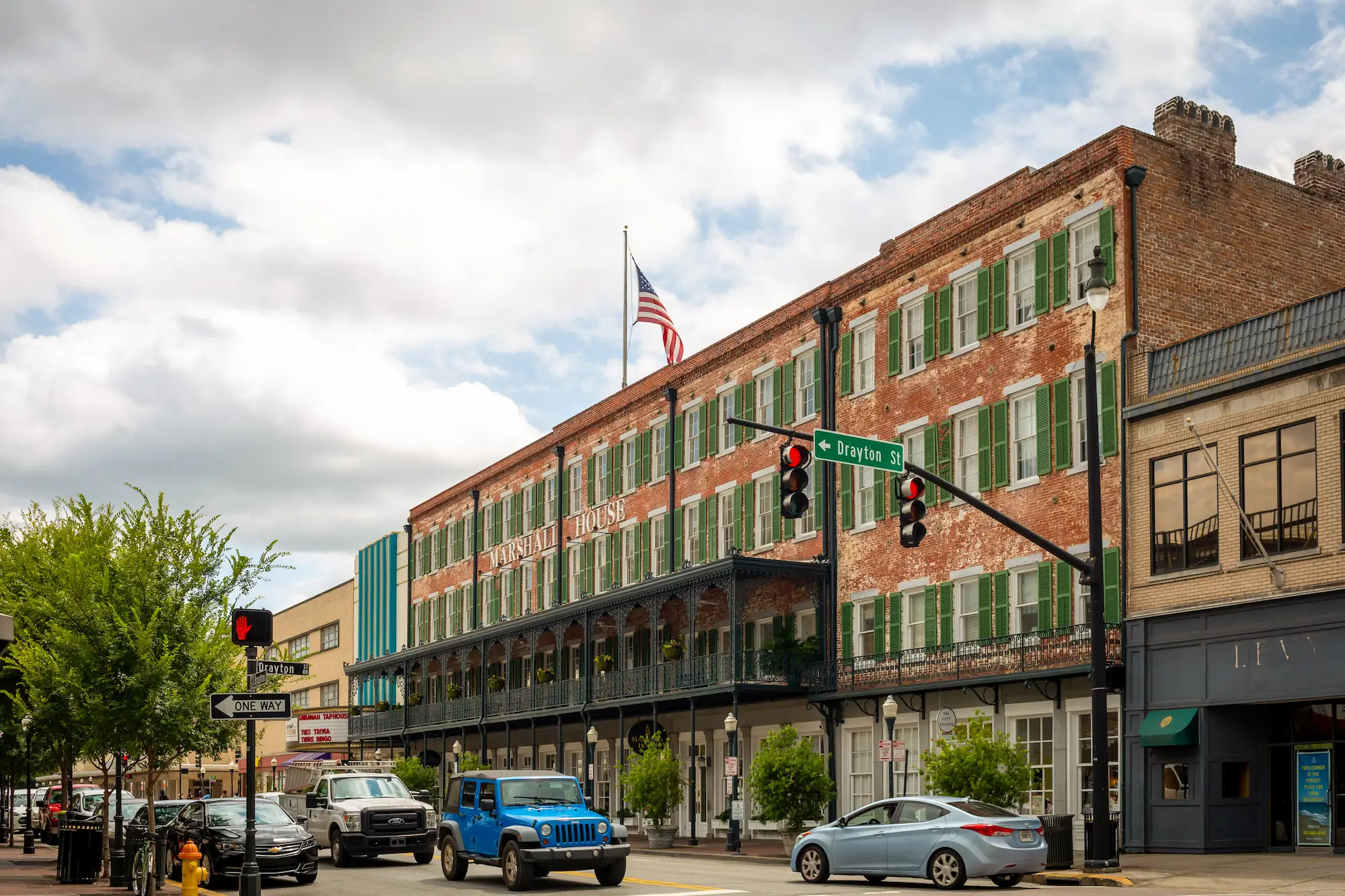 the Broughton Street facade of the Marshall House in Savannah Georgia, with other shops and stores