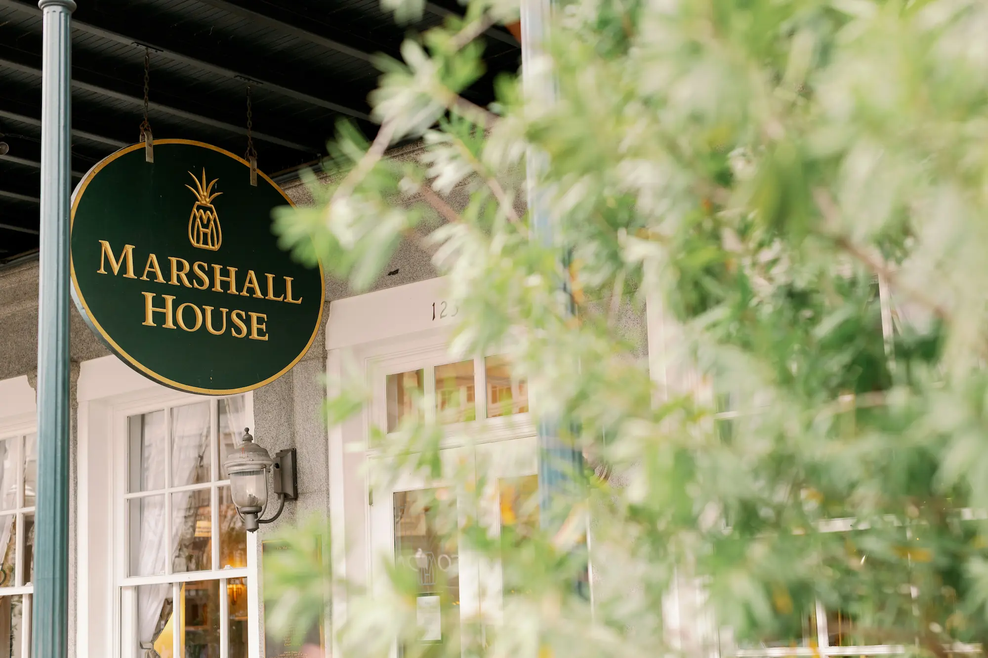 the hanging sign of the Marshall House in Savannah Georgia