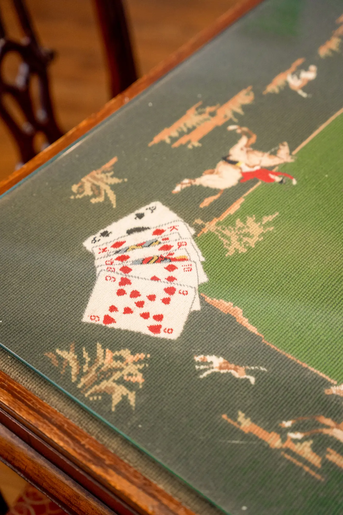 details of a jacquard covering on a card table in the Marshall House in Savannah Georgia