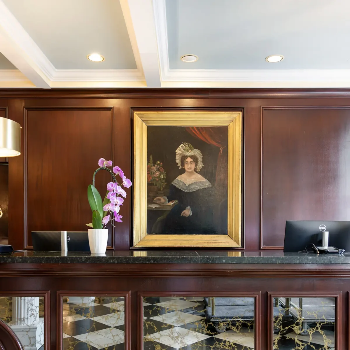 a portrait of Mary Marshall over the check-in desk