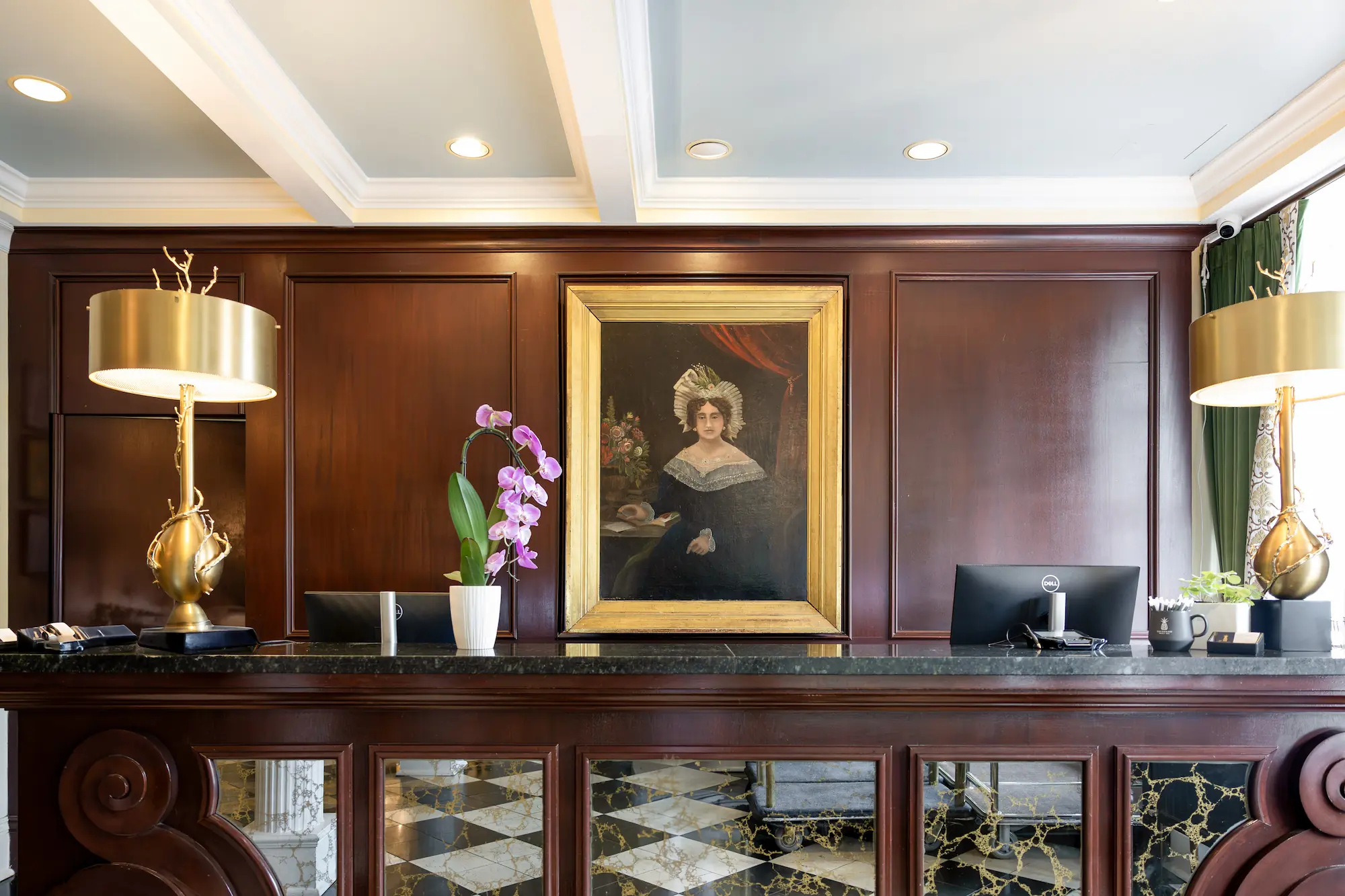 a portrait of Mary Marshall over the check-in desk