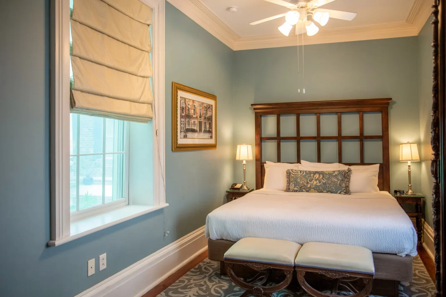 the bedroom of the luxury king suite at the Marshall House hotel