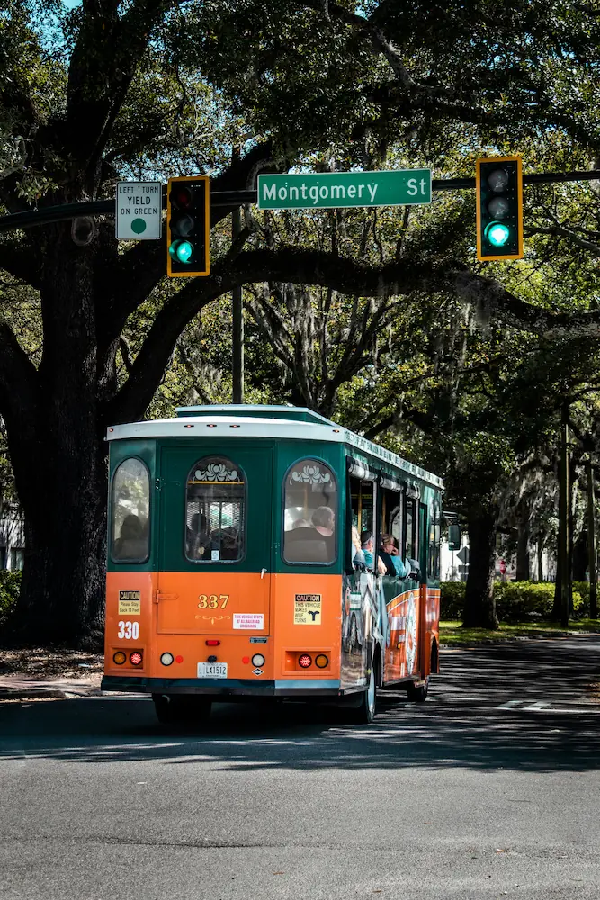 A tour bus crosses the street in Savannah, Georgia